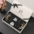 Luxe keramische koffiekop en schotel set met geschenkdoos, zwart-wit stijlvol design. - Zwarte Mok Witte Lelie