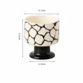 Taza de cerámica con pie alto y patrón abstracto en blanco y negro, diseño elegante y moderno. - Taza de Aromaterapia - Cubo de Agua