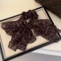 Coletero para el pelo con estampado de leopardo retro y lazo, elegante accesorio. - Leopardo Café