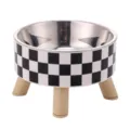 Elevated stainless steel pet bowl with black and white checkerboard pattern and wooden legs. - Black and White Plaid Stainless Steel Raised Bowl