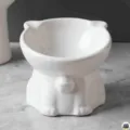 White ceramic raised cat bowl, cute pet feeding dish with ergonomic neck protection design. - White