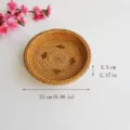 Detailed view of handmade woven rattan storage basket, showing fine texture and edges. - Cross-Pattern Storage Basket / Small 23cm / Brownish Yellow