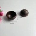 Detailed view of natural coconut shell candle cup, eco-friendly container for home decor. - Polished Style 9-11cm