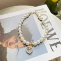 Elegant princess style cat pearl necklace with crystal heart pendant pet photo accessory - Iridescent Gem