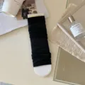 Black cotton stirrup leg warmers slouch socks for stylish everyday outfits and daily wear. - Black