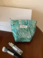 Detail view of the luxury jacquard cosmetic bag, stylish pattern and spacious interior. - S / Dark Green Ocean