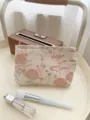 Floral cosmetic bag detail, elegant pink and green embroidered pattern for daily travel. - M / Pink