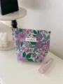 Detail view of the vintage French floral jacquard cosmetic bag showing fine woven fabric texture. - S / Purple Daisy Flower