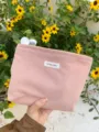 Pink corduroy cosmetic bag for women, stylish large capacity makeup pouch for daily use. - Non-Woven Lining / Light Pink