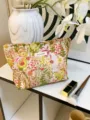 Detailed shot of a floral canvas cosmetic bag with zipper, stylish makeup storage pouch. - L / Floral Jungle