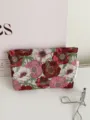 Vintage floral jacquard cosmetic bag close-up, stylish fabric travel makeup pouch detail. - M / Red White Pink Floral