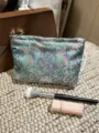 Detailed view of the vintage Chinese style brocade cosmetic bag with peony floral pattern. - M / Green Background with Purple Flowers