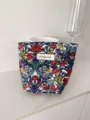 Vintage floral cosmetic bag detail shot, portable makeup storage pouch, travel toiletry organizer. - S / Vintage Blue Red