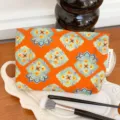 Ethnic style orange cosmetic bag with vintage floral pattern, portable travel makeup pouch. - Ethnic / M