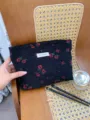 Black floral cosmetic bag detail view, large capacity daily makeup pouch with stylish woven design. - L / Black with Red Floral