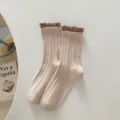 Women vintage cable knit mid-tube socks with contrast ruffle cuff, cozy cotton casual wear variant. - One Size / Khaki