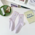 Light purple ruffled cotton mid-tube socks with cute embroidered flower for women. - One Size / Purple