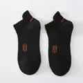 Chaussettes de sport courtes noires pour femmes avec languette et détails orange. - Taille unique / Noir