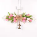 Artificial tulip door swag wreath with burlap bow and bronze bells for spring home decor. - Pink