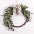 Artificial olive leaf wreath detail showing wooden beads and rustic striped bow decor. - 73238 Striped Bowknot