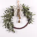 Detailed view of the artificial olive leaf wreath featuring a bow, hanging bells, and wooden beads. - 73238 Striped Bowknot + Bell