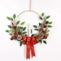 Christmas wreath detail showing frosted leaves, red berries, pine cones and glitter bow. - Red 80364