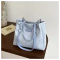 Light blue star print tote bag featuring purple straps and metal chain detail, casual commute style. - Blue No Charm