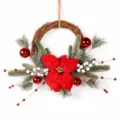 Christmas vine wreath decoration with artificial poinsettia pine branches and red berries. - Classic Red Berry Style
