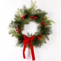 Christmas pine wreath with red berries and velvet bow for holiday door and wall decoration 40cm - S
