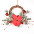 Close-up detail of Christmas wreath with red poinsettia, frosted pine branches and berries. - Snow Cedar Berry Style