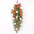 Artificial Christmas teardrop swag with velvet bow and flocked pinecones for holiday decor. - Beige