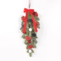 Close-up detail of Christmas teardrop swag featuring flocked pine and velvet ornaments. - Red White Green