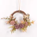 Artificial autumn flower wreath detail view with vintage fake chrysanthemums and twine hanging. - Purple Coffee