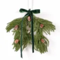 Christmas pine branch hanging decoration with cones and green bow for home decor. - 86539