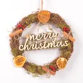 Christmas rustic twig wreath with wooden merry christmas letters, dried orange slices and moss. - Merry Christmas