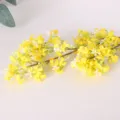 Artificial yellow osmanthus flower branch detail close up, realistic faux floral decor. - Leafless Yellow
