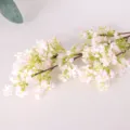Artificial pink flower branch detail close up, home decor floral arrangement prop. - Leafless Pink