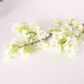 Artificial white flower branch detail view, perfect for home decor and floral arrangement. - Leafless White
