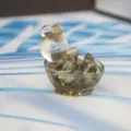 Close-up detail view of the cute crystal turtle figurine, resin and stone desktop decor. - Labradorite