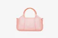 Dettaglio borsa a mano jelly in PVC trasparente rosa, con design traforato elegante e manico rotondo. - 31.5x11x16.5cm / Transparent Pink
