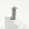 Rhinestone cylinder keychain detail shot showing sparkling crystal texture and metal ring. - White