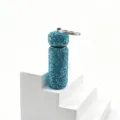 Detail view of the sparkly rhinestone mini sub-packaging bottle keychain, stylish bag charm. - Blue