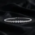 Detailed view of a gradated tennis bracelet set with brilliant cut stones in silver finish. - 7.5 Inch / Gradient Tennis Bracelet (BR024993) / 2.95CT / D Color Lab Diamond (Gradient)