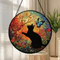 Stained glass window hanging featuring a black cat and blue butterfly design with vibrant colors. - 15x15x0.3 cm / Black Cat And Butterfly