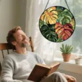 Round stained glass hanging window panel with monstera leaves pattern, vibrant home decor suncatcher. - 15x15x0.3 cm / Monstera