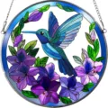 Detailed view of the stained glass hummingbird acrylic suncatcher with vibrant purple flowers. - 21