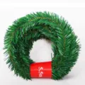 Detail shot of the 5.5m green Christmas tinsel garland, showing the dense pine needle texture. - 5.4m Leaf Width 3.5cm Style / Green