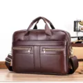 Close-up of premium dark brown leather business briefcase with dual zipper pockets and durable hardware. - Brown