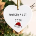 Christmas white heart shaped acrylic ornament with funny holiday quote and hanging string. - Style 1