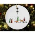 Detailed view of minimalist Nativity scene Christmas tree ornament hanging on festive branches. - Style 5
